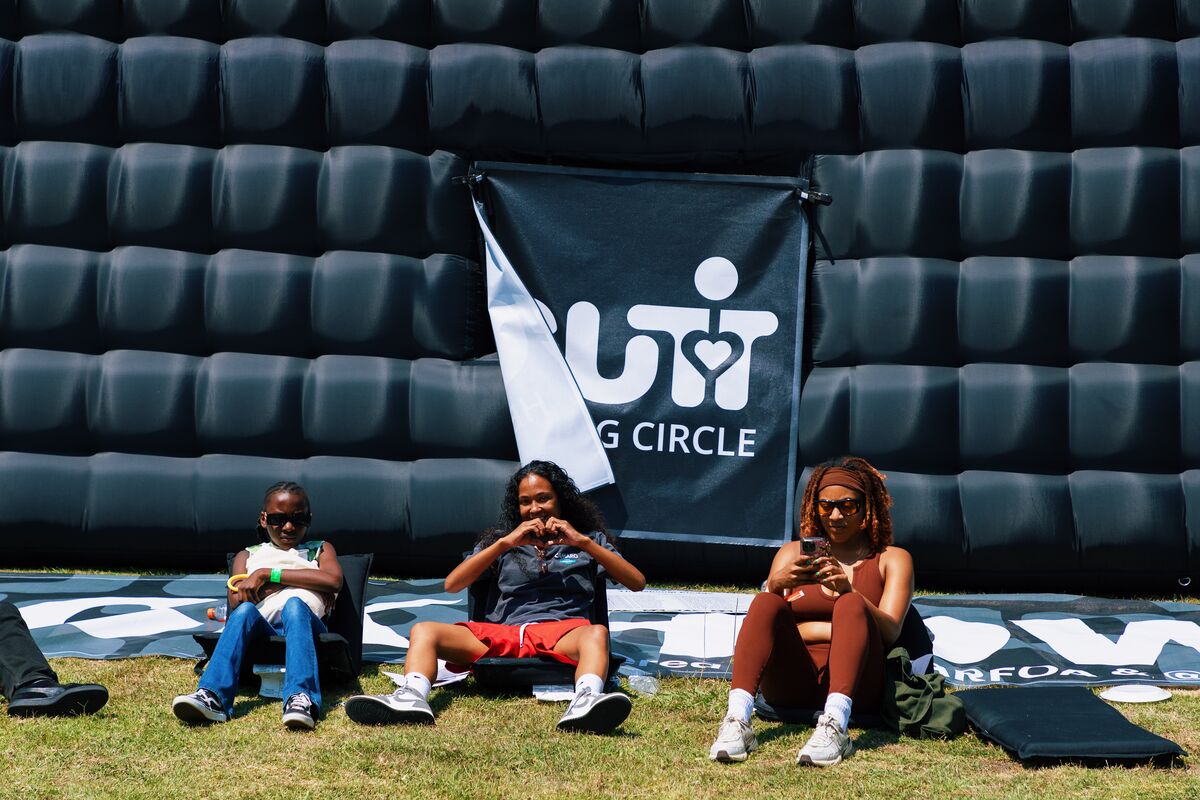 Young attendees making heart shapes with their hands at the GUT Healing Circle