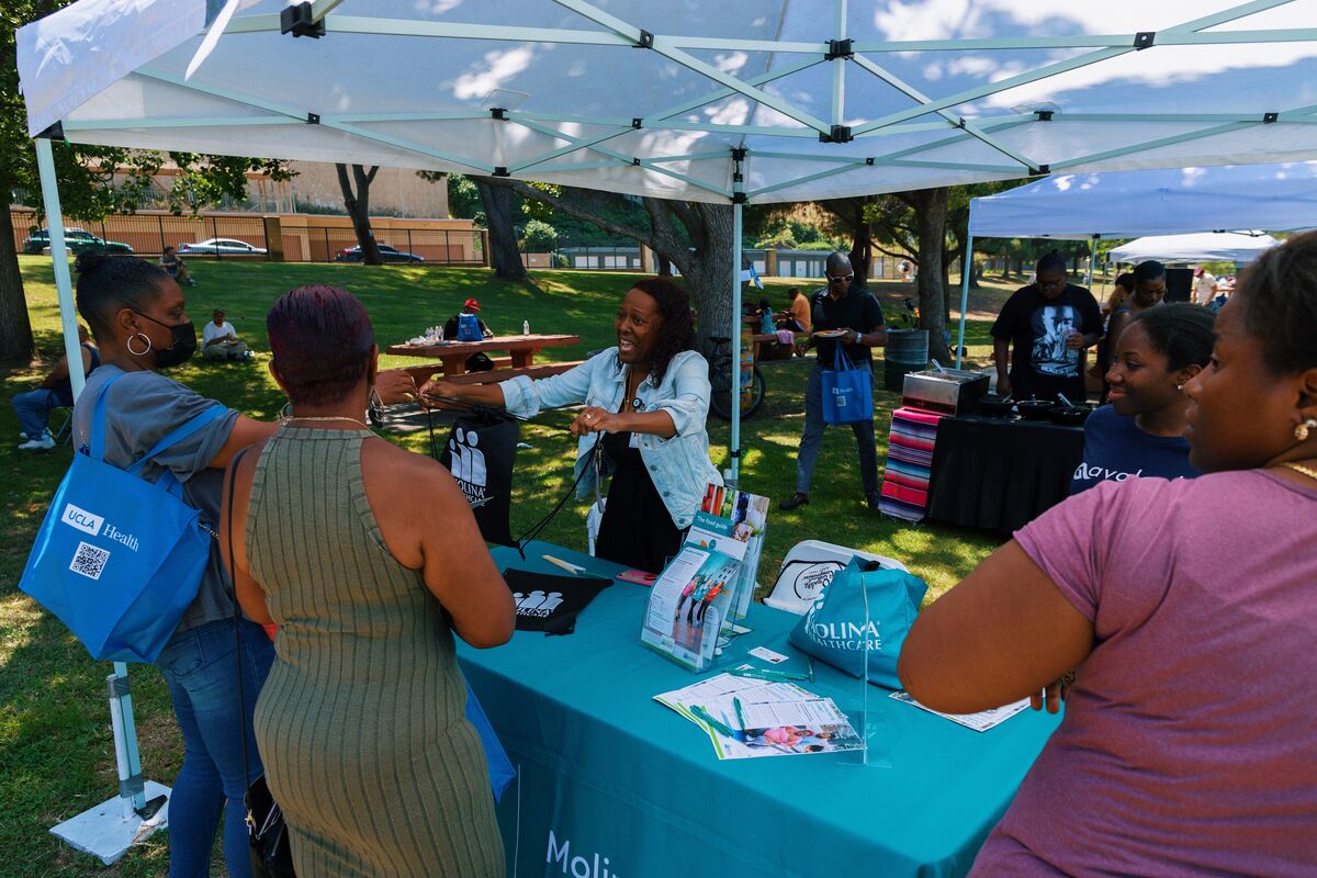 Molina Healthcare partner engaging with community members at the health fair