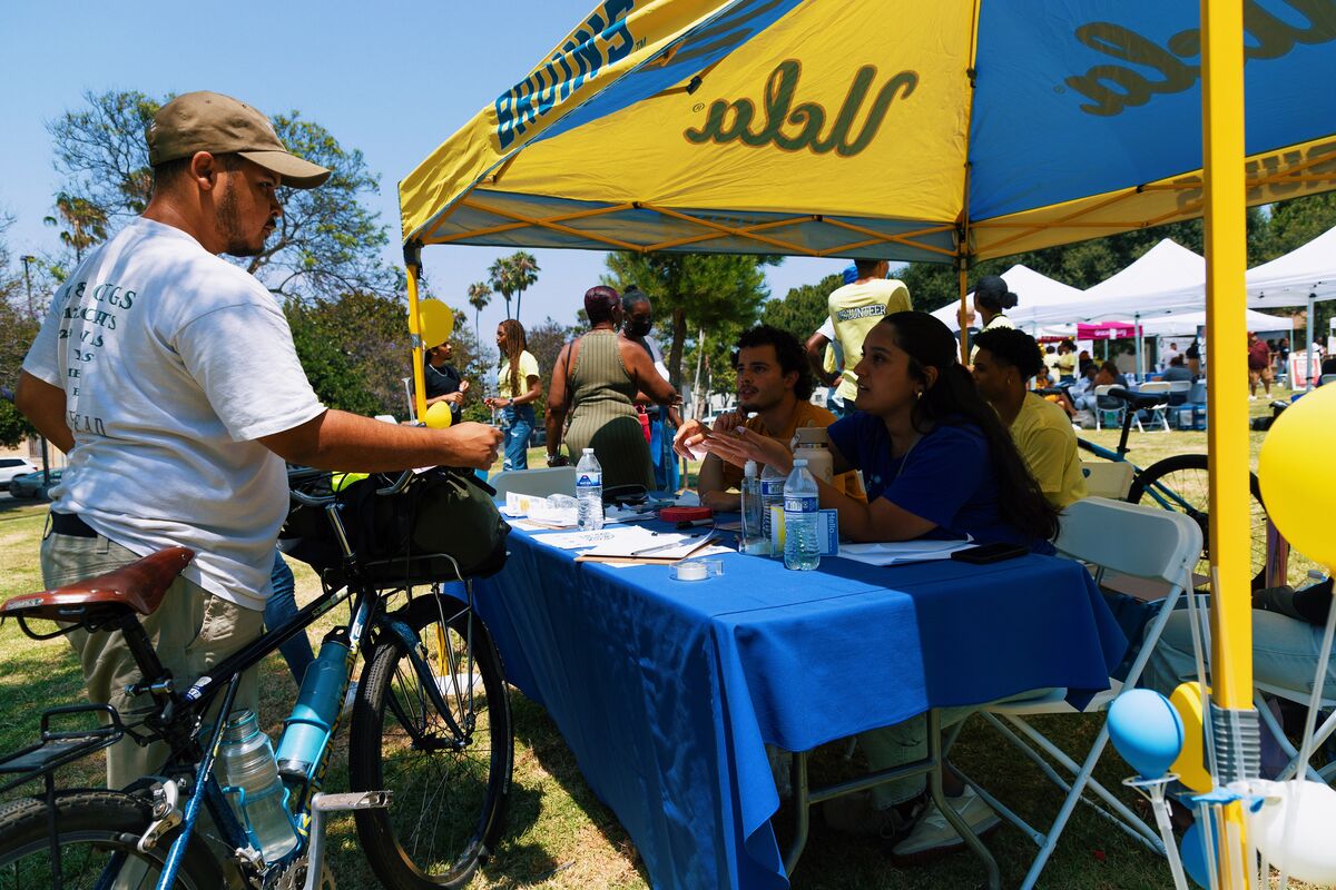Molina Healthcare partner booth with community members receiving health information